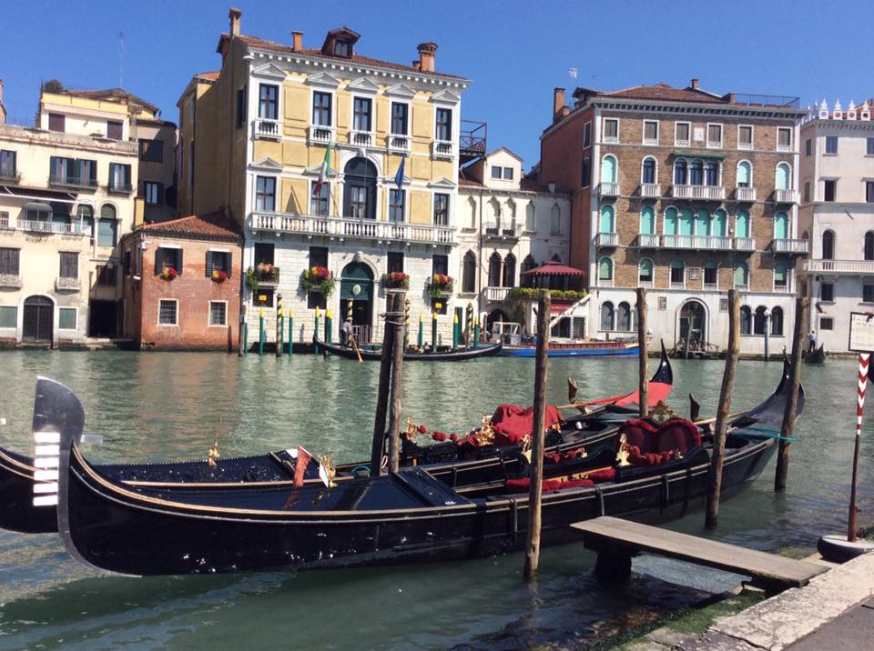 Venetian gondola and houses on the Grand Canal